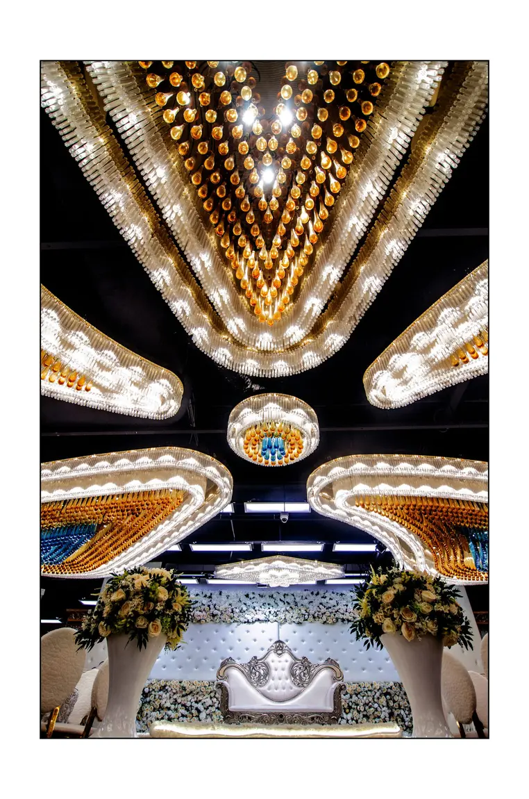 Crystal chandelier above the bridal dais