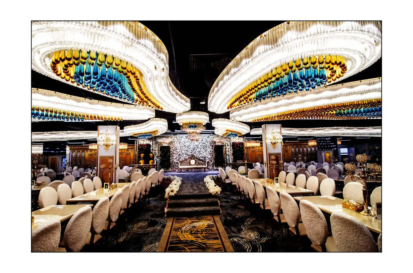 Wide view of The Istana Ballroom set with round tables