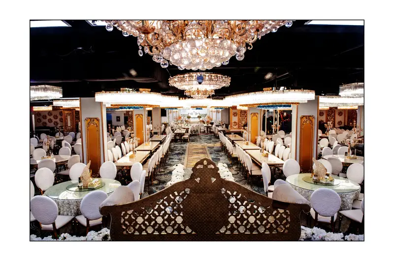 Rose gold chandeliers over round and long tables